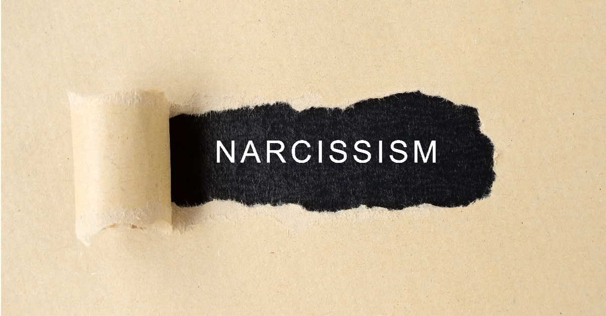 Narcissism-word-revealed-by-torn-paper-how-to-spot-narcissism-how-to-deal-with-narcissism-iMind-Mental-Health-Solutions.