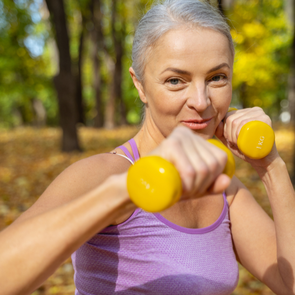 woman holding yellow weights, Exercise Benefits on Mental Health, iMind Mental Health Solutions