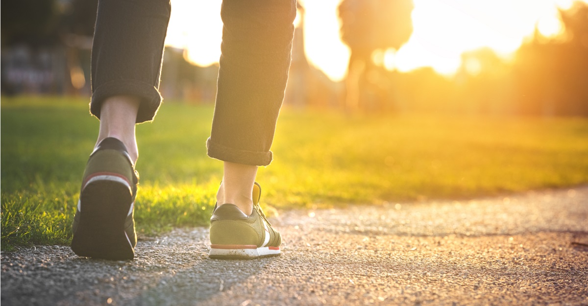 a-person-walking-on-a-path-with-just-shoes-legs-and-pants-visible-exercise-benefits-on-mental-health-iMind-Mental-Health-Solutions