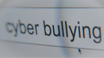 the-word-cyber-bullying-in-a-search-bar-with-the-mouse-arrow-pointing-to-them-social-media-affects-on-mental-health-iMind-Mental-Health-Solutions