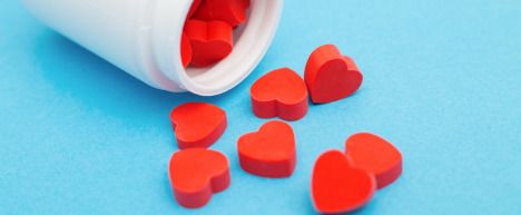 pill-bottle-of-red-heart-shaped-pills-spilled-over-on-a-table-the-psychology-of-attraction-iMind-Mental-Health-Solutions