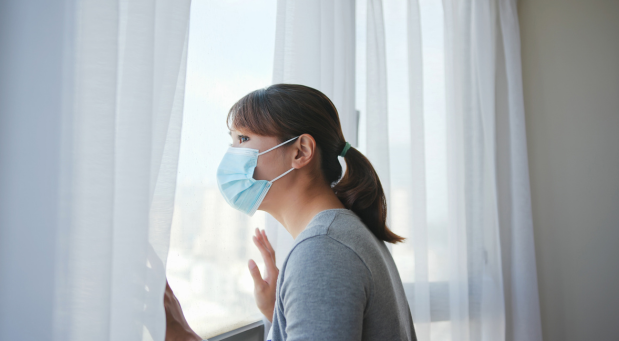 woman-with-a-mask-on-looking-out-the-window-why-is-everybody-depressed-iMind-Mental-Health-Solutions