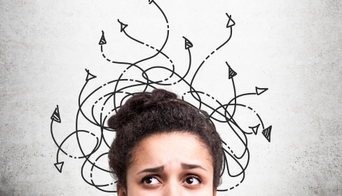 woman-looking-confused-with-a-tangled-mess-of-arrows-are-drawn-around-her-head-iMind-Mental-Health-Solutions.