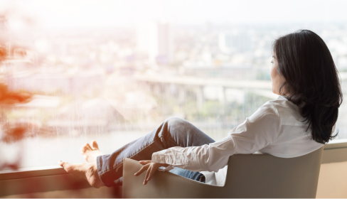 woman-with-feet-up-looking-out-a-window-what-is-limerence-iMind-Mental-Health-Solutions