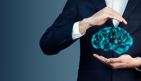 hands-hovering-in-a-cradling-position-over-an-artistic-representation-of-a-brain-how-vitamin-D-affects-mental-health-iMind-Mental-Health-Solutions.