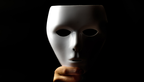 one-white-mask-held-up-by-a-hand-passive-aggressive-port-st-lucie-stuart-fl-iMind-Mental-Health-Solution