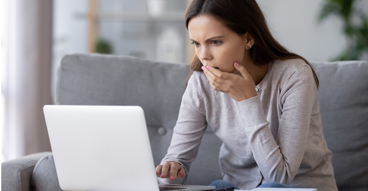 woman-looking-at-her-computer-with-horror-catastrophizing-what-it-is-how-to-stop-it-iMind-Mental-Health-Solutions