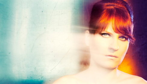 woman-looking-directly-at-the-camera-with-an-angry-look-on-her-face-how-divorce-affects-the-children-iMind-Mental-Health-Solutions.